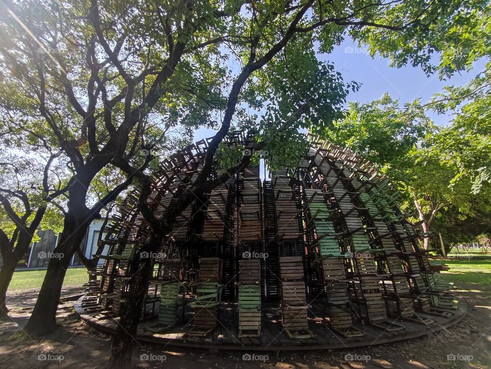 Dome built with  school used wooden chairs, installation decoration