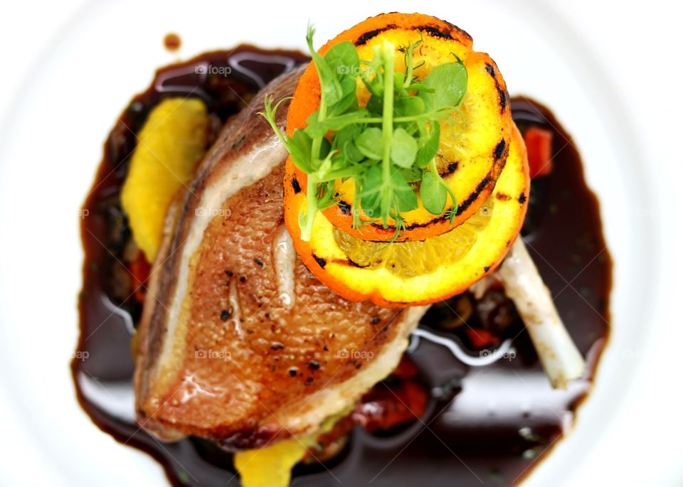 Food, carrigclenna free-range duck, crisp skin duck brest with sauce of orange, green olive, fresh herbs & spices