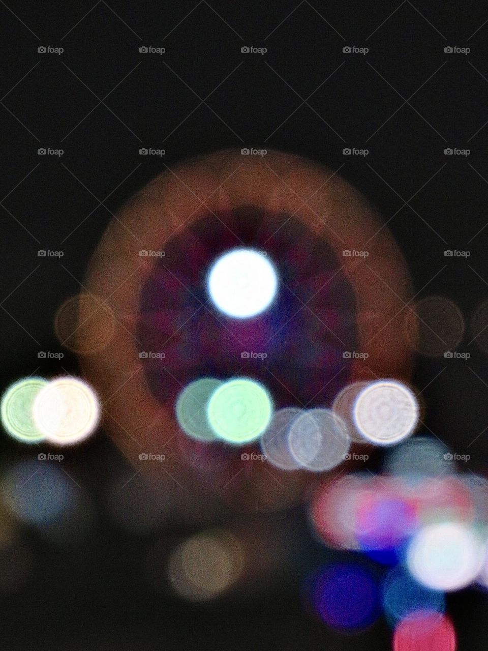 Bokeh Photo of a Ferris Wheel and Circus Lights