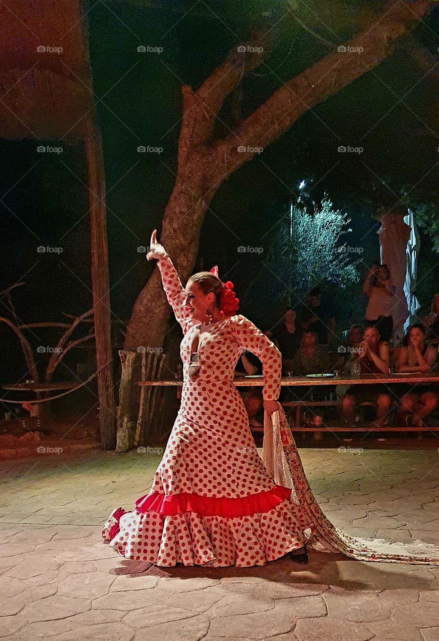 Spanish dancer in traditional costume dancing at a show in Balearic islands