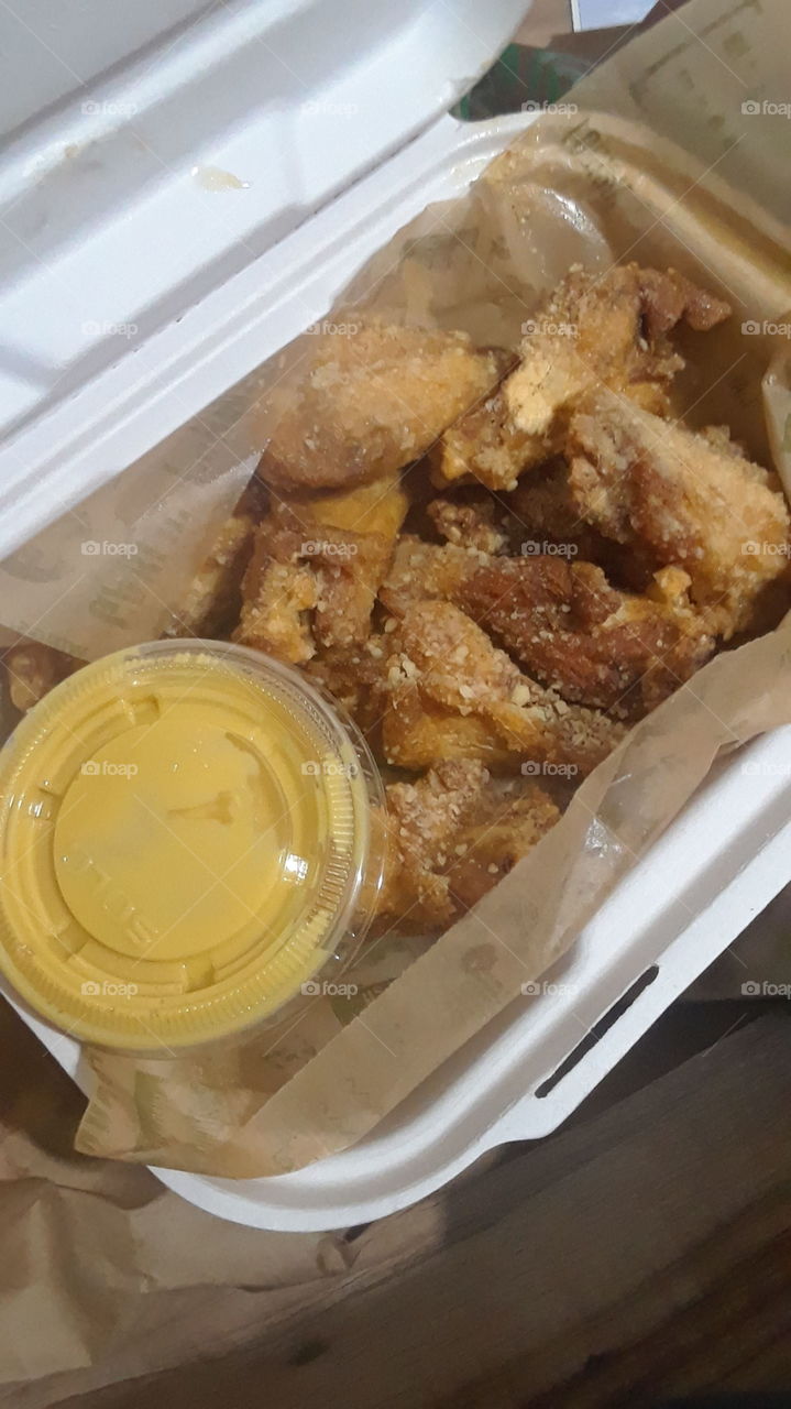 This pictures is delicious and looks tasty.The wings look cheesy and very good.The wings that u desire are only at wing stop.People love these wings everyday.