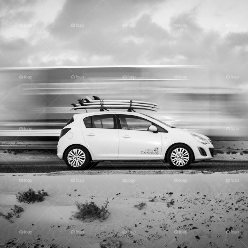 Blur. Corsa in Fuerteventura with surfboards