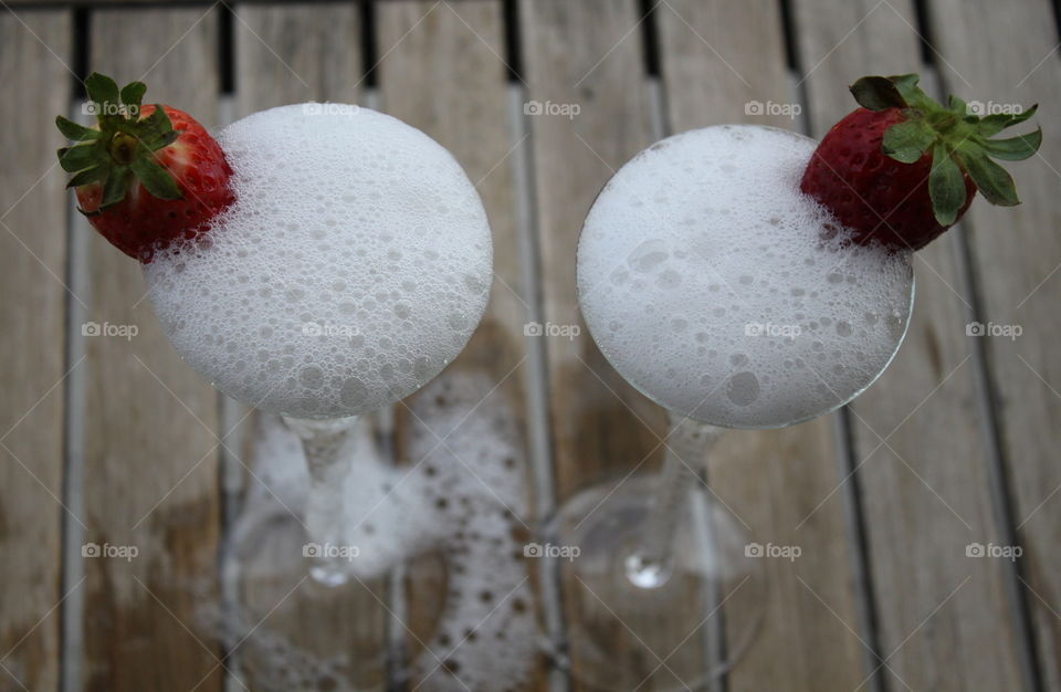 2 glasses of Champagne bubbles with Strawberries