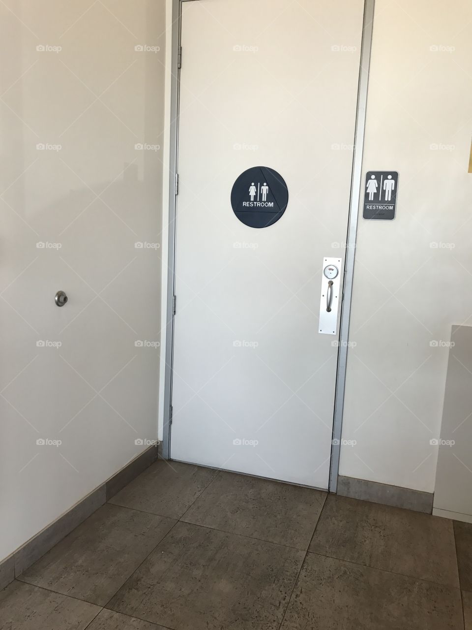 Unisex bathroom door