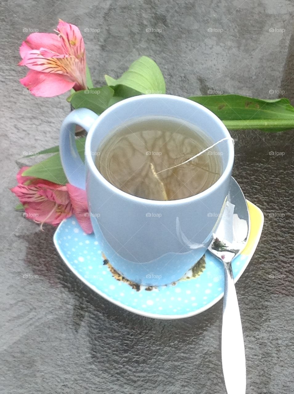 Having a cup of tea outdoors enjoying the beautiful Spring weather.