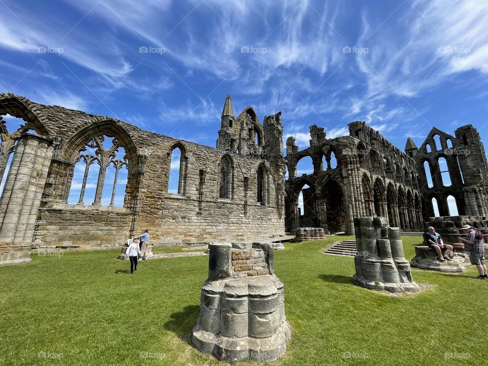 Inside Whitby abbey with clouds 