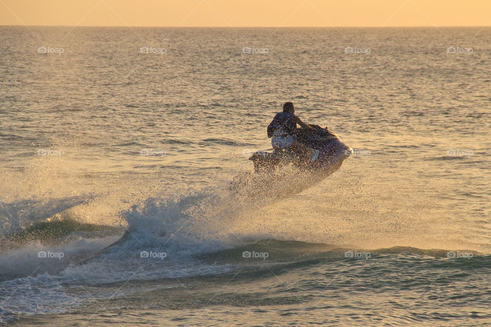 Man enjoy driving jetski on the ocean