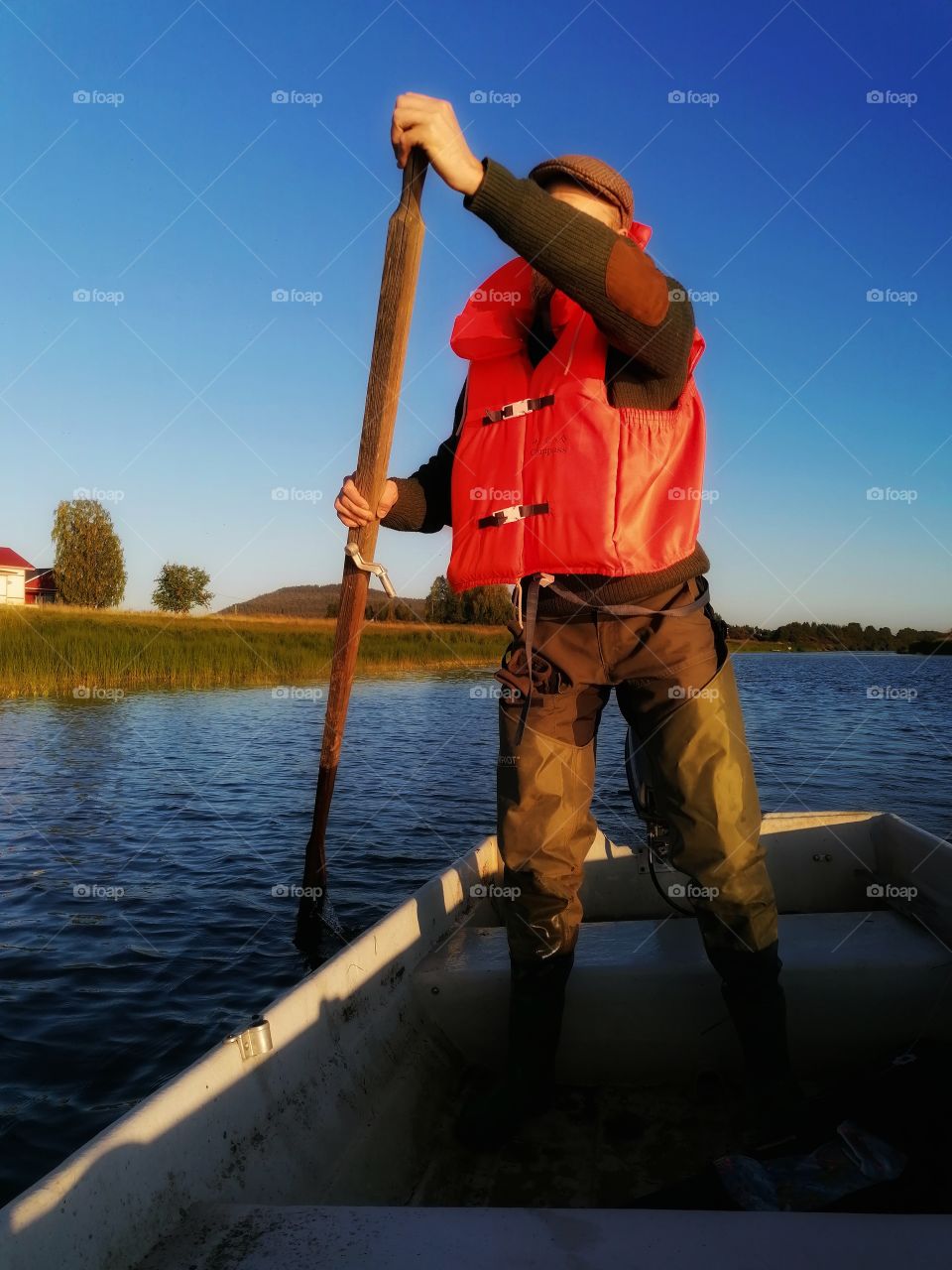 The man in the boat. It is so shallow that you have to try to get deeper on the Tornio River with a paddle first.