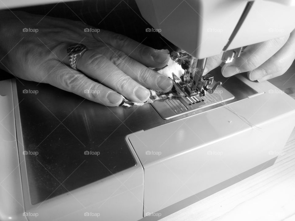 Close-up of a person sewing on sewing machine
