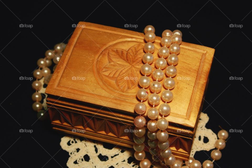 jewelry box, pearl beads, on an openwork napkin