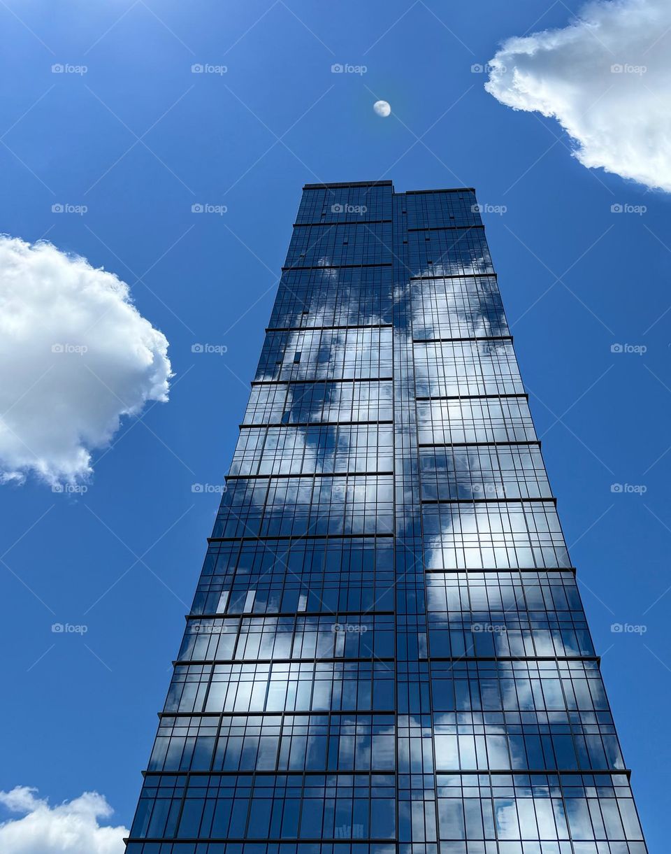 Clouds reflected in a glass skyscraper 