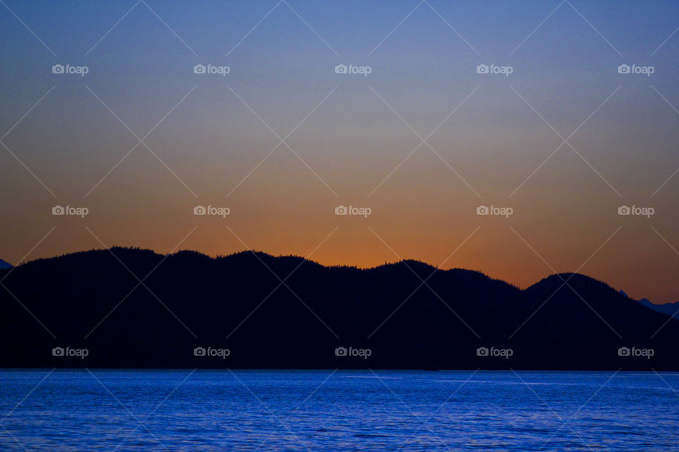 ocean summer sunset mountains by kghilieri