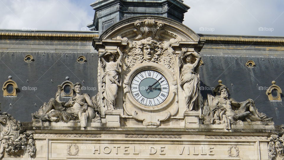 Hotel de Ville in France, beautiful facade with stunning statues a clock and font photo by Lika Ramati 
