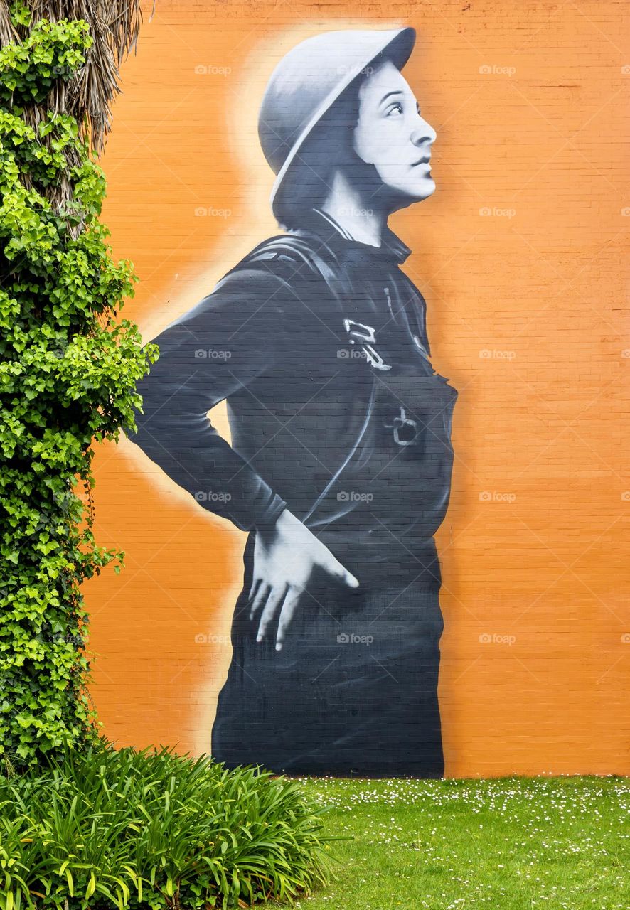 Mural of Molly Williams first female firefighter in US, by Portuguese street artist Robot.