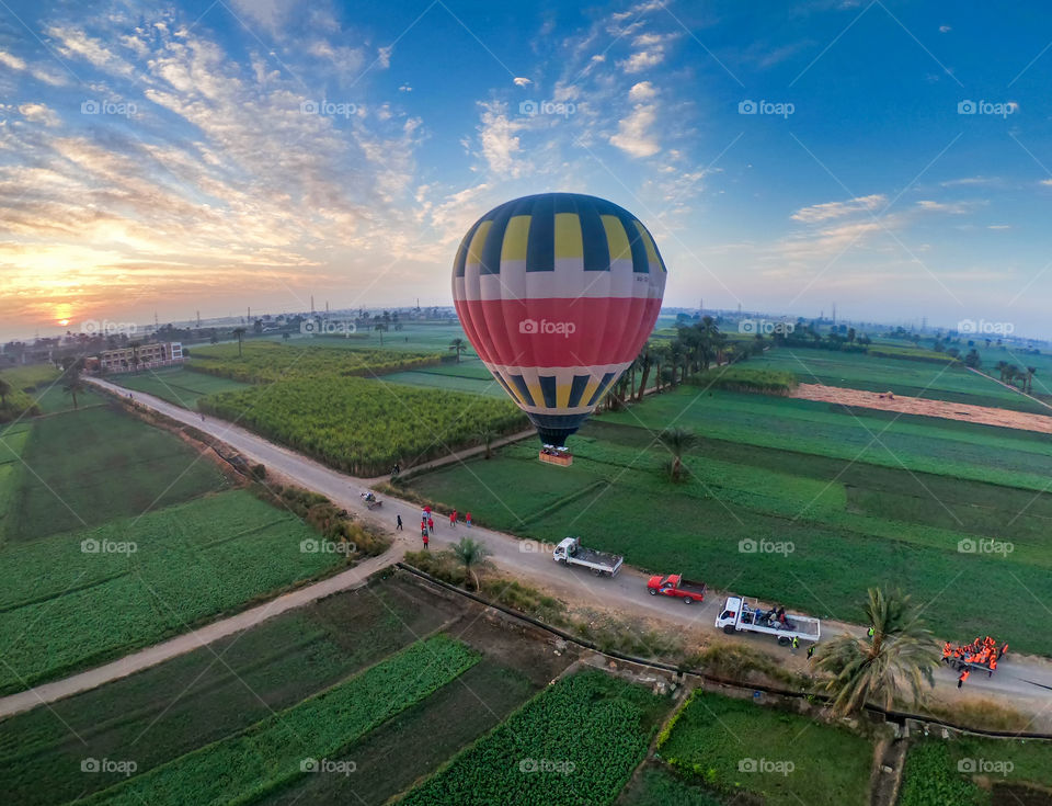 Balloon time in sunrise moment above the nice field view