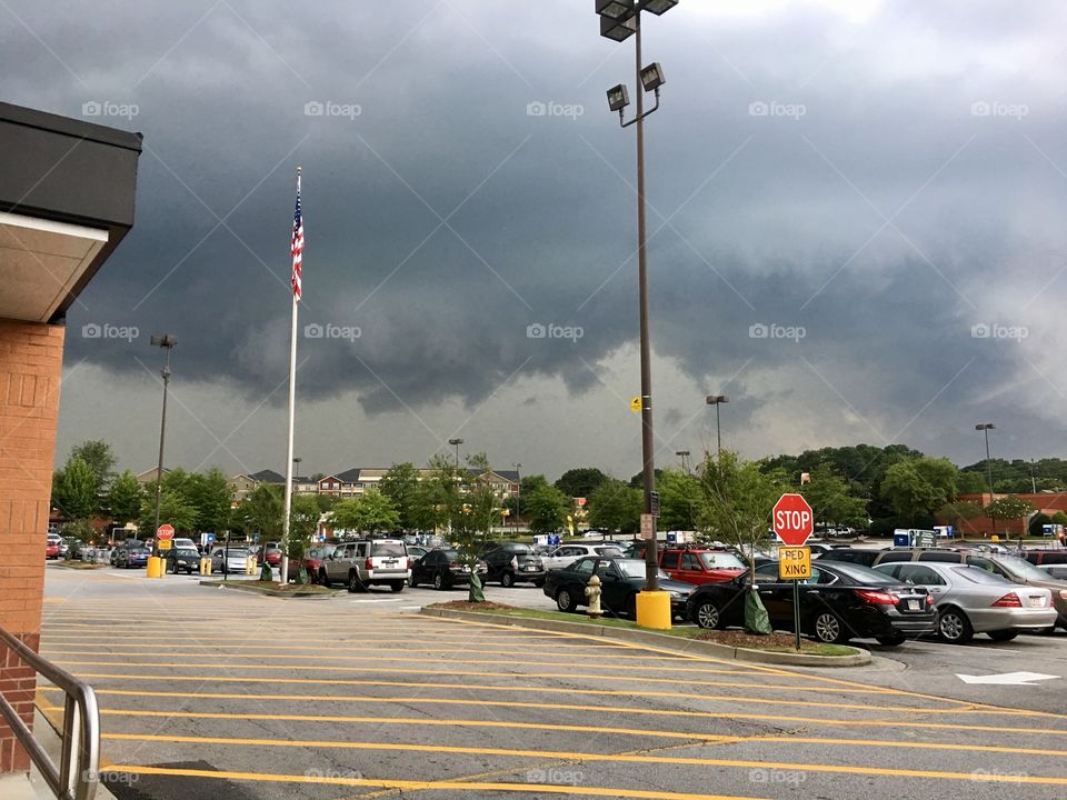 Storm clouds from a parking lot.