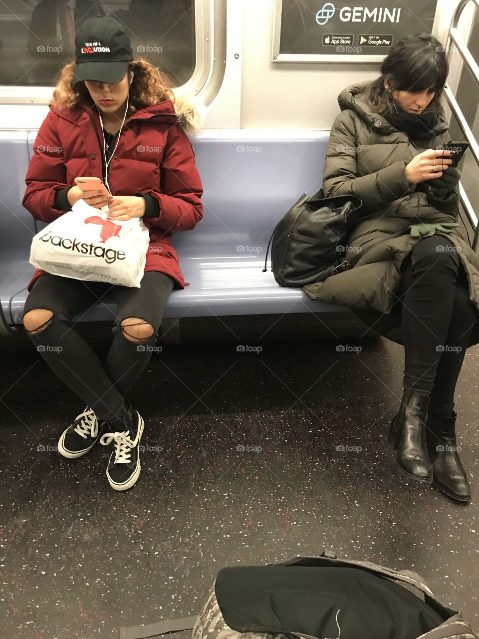 Two pretty ladies on the downtown F train approaching 42nd Street & 6th Avenue.