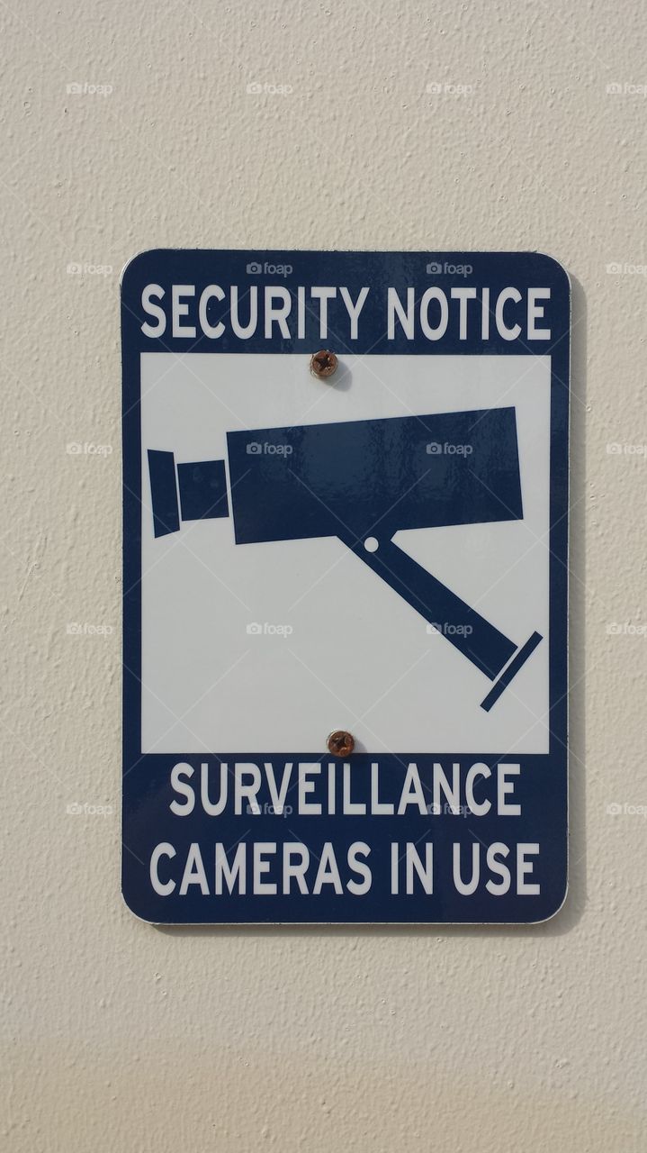 Big Brother Watches. A surveillance sign on college campus.