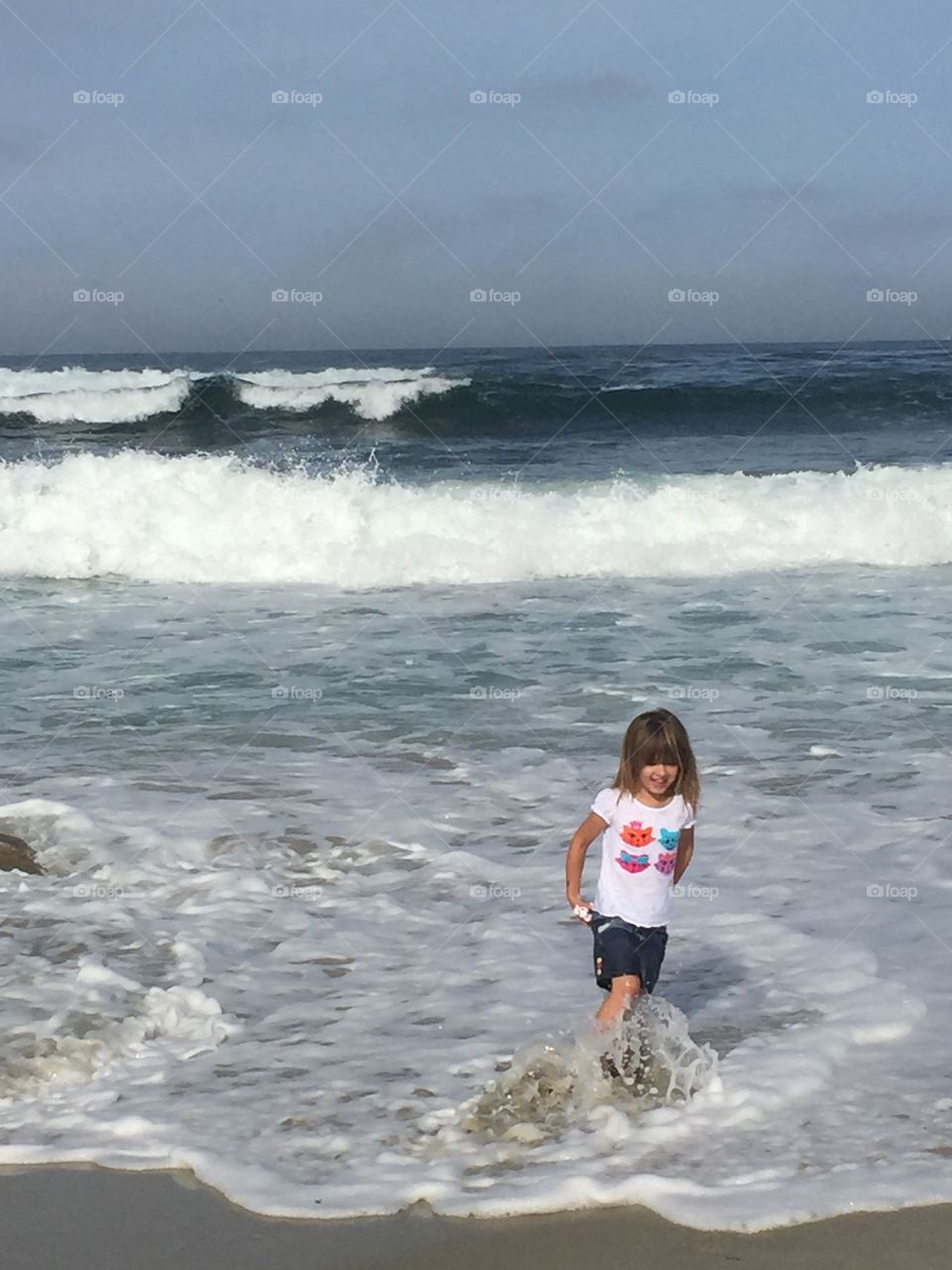 Girl enjoying wave at beach