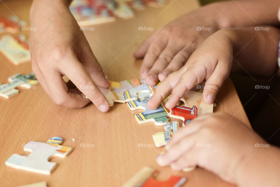 Children putting a puzzle together