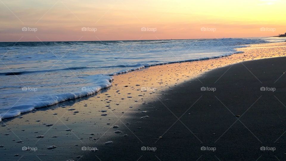 Idyllic view of beach at sunset