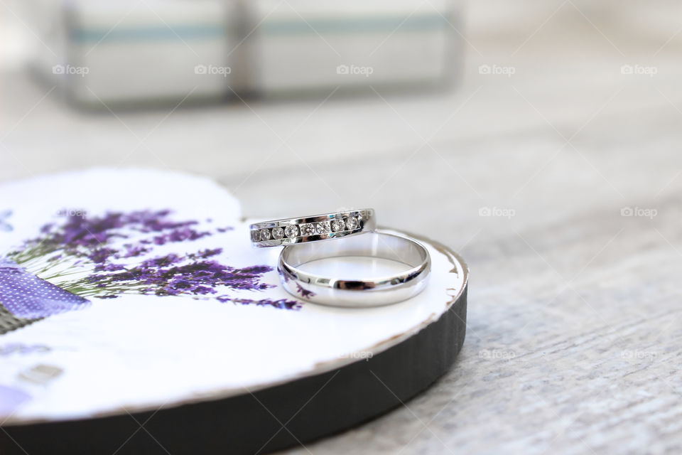 Wedding rings in white gold on the table 