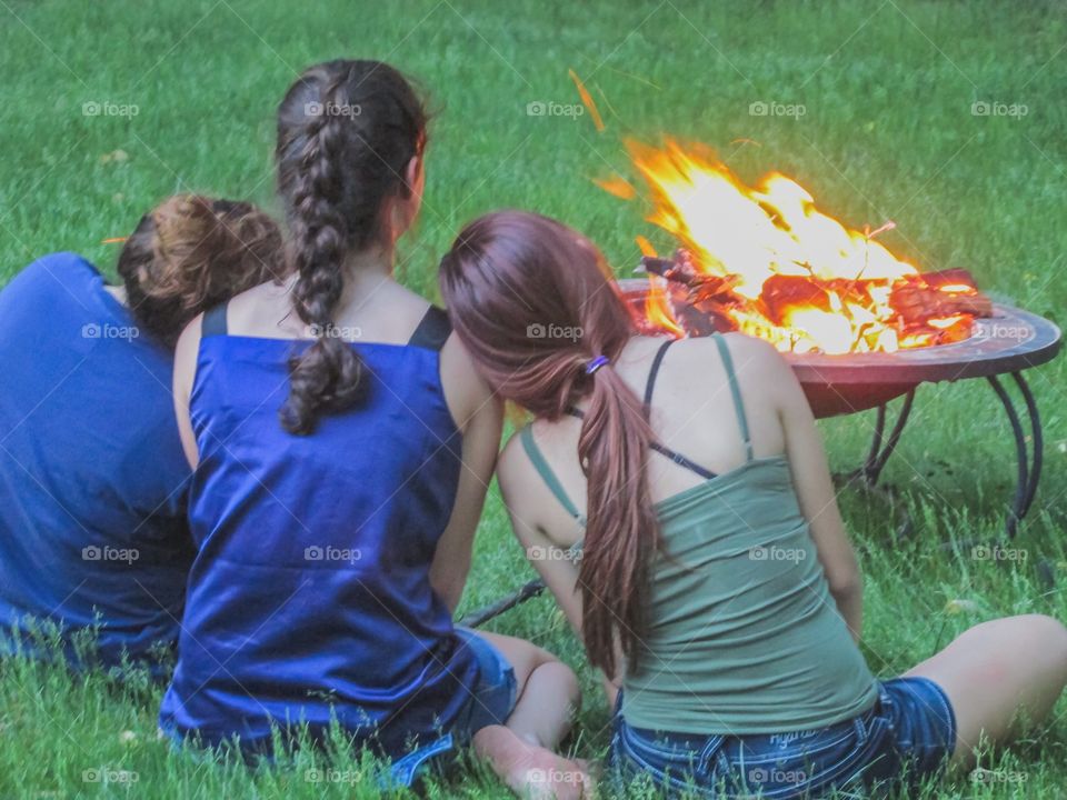 Three friends around a campfire - Odd Numbers Mission