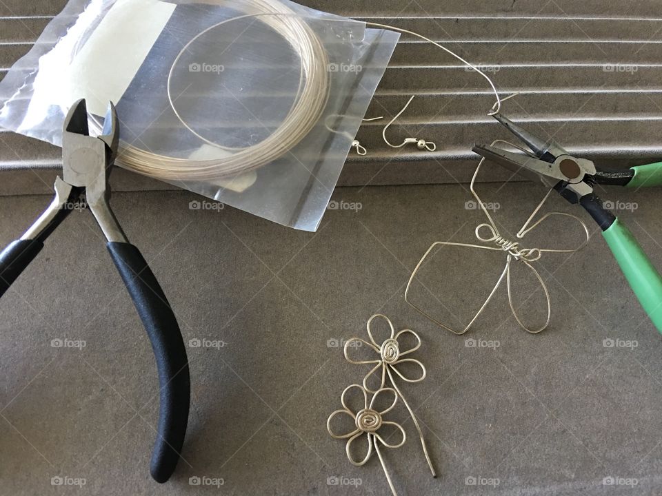 Silver wire and pliers for crafting 