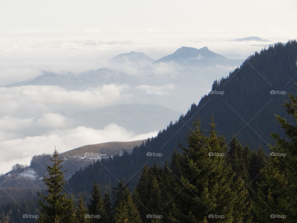 Clouds over mountain during winter