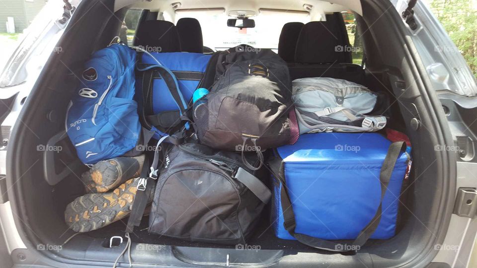 Travel bags packed into vehicle
