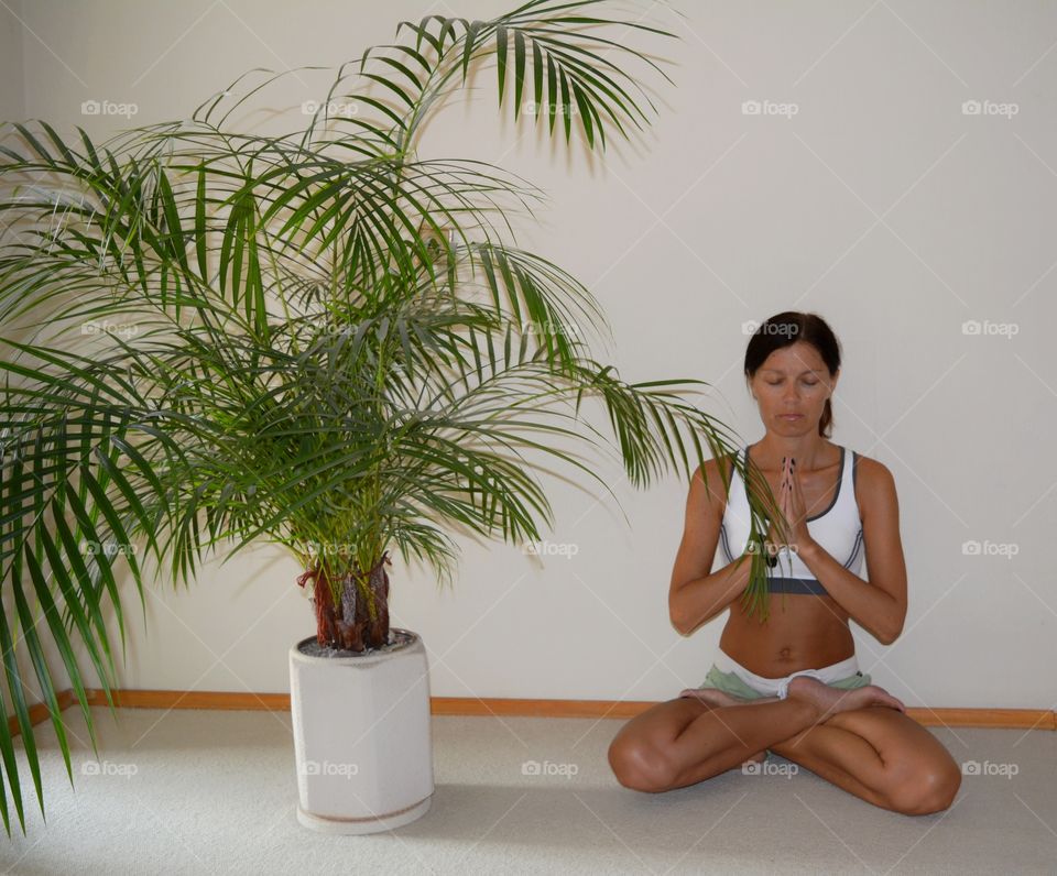 girl training yoga meditation indoor