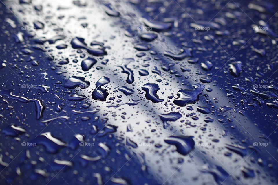 Water droplets on Blue Surface 