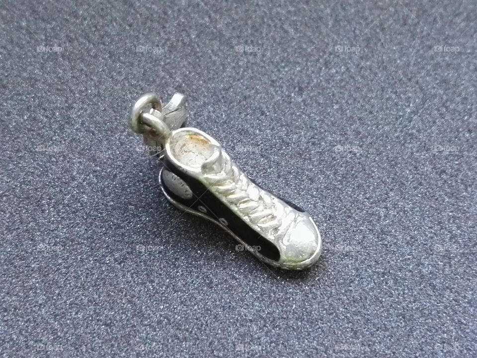 silver pendat in shape of shoe