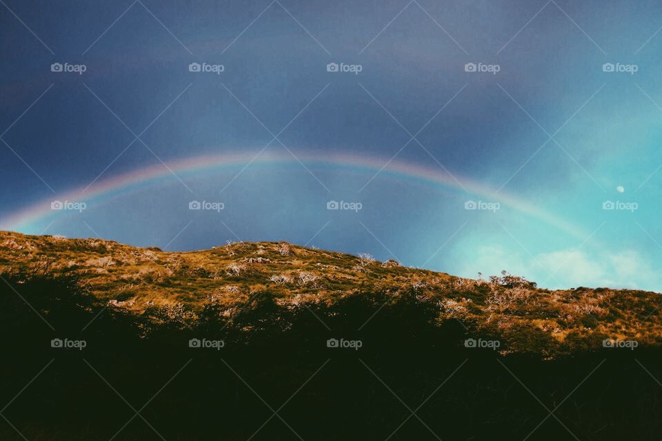 Hawaiian rainbow over the mountains.