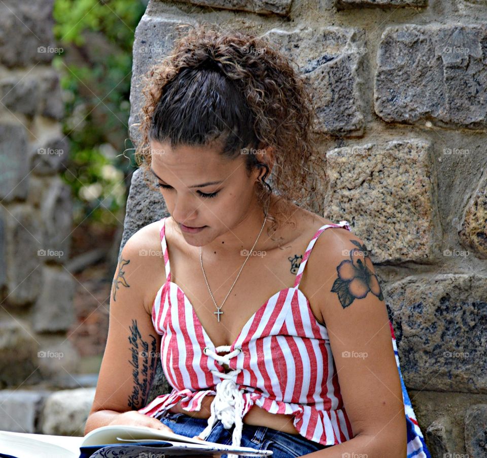 reading a book in the park on a summer day