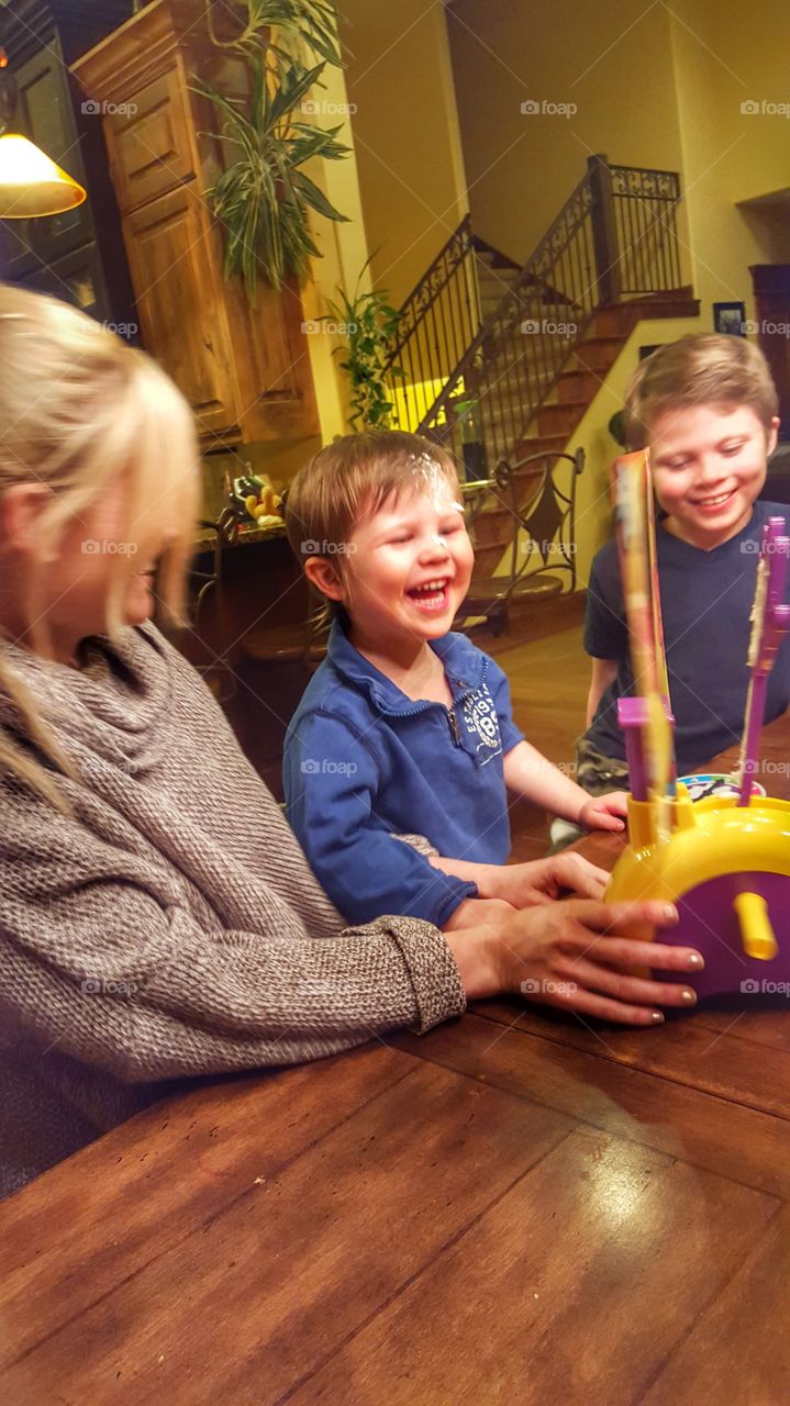 family playing pie face