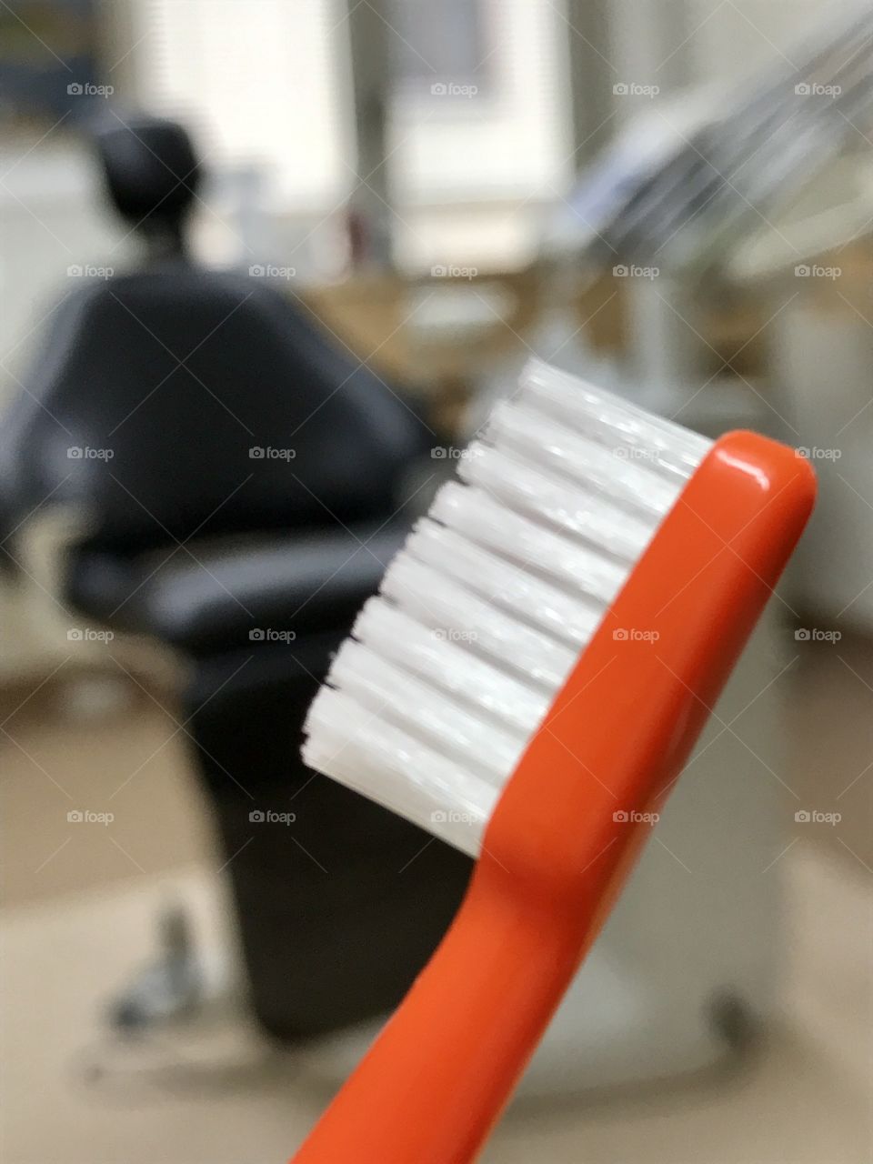 Toothbrush with dental chair background 