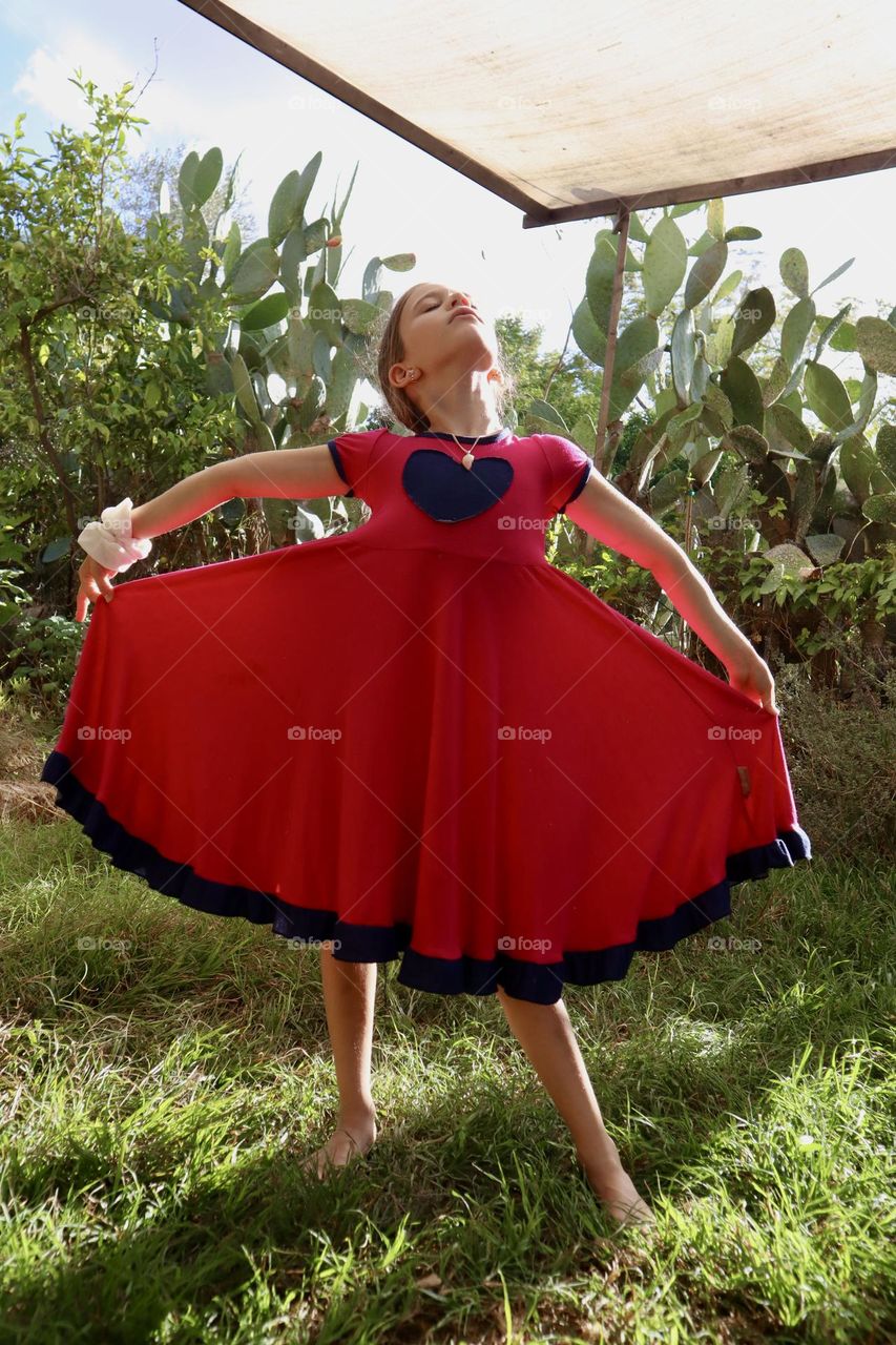 Girl dancing with her pink dress