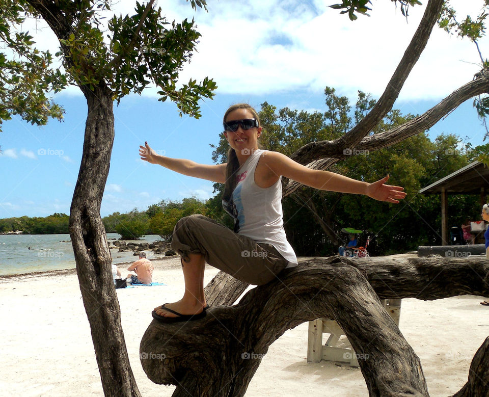 Girl in tree. Happy about tree 
