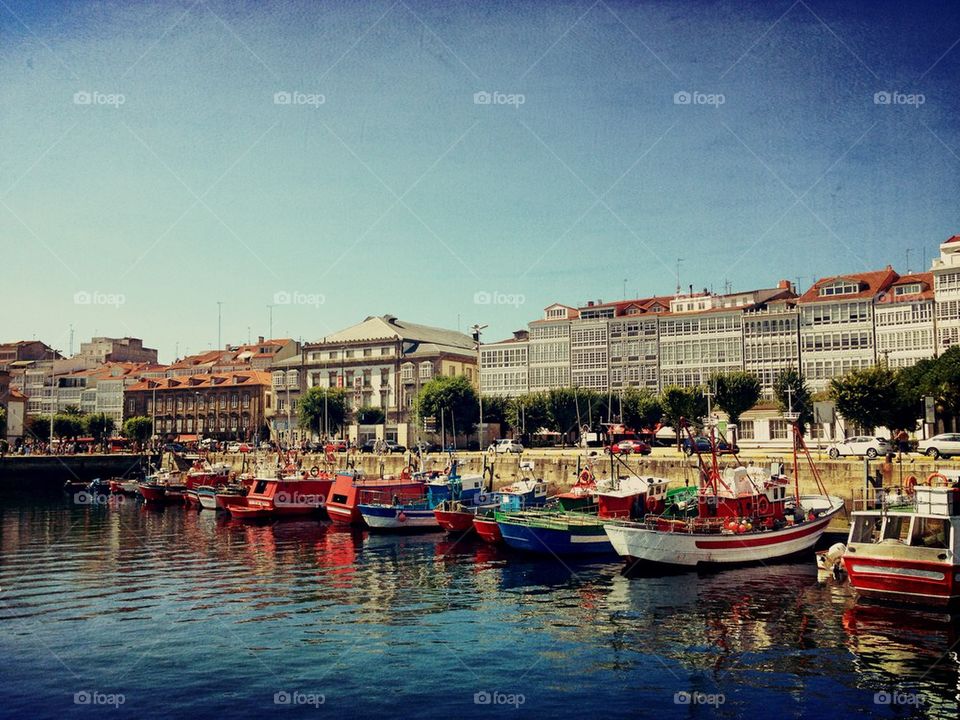 Boats moored at harbor