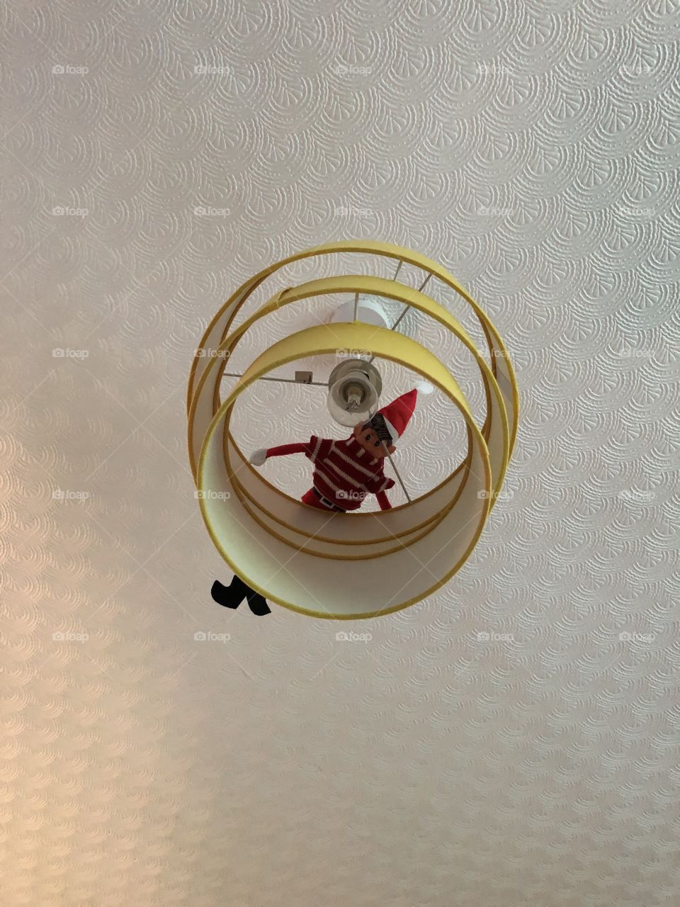 Naughty elf playing hide and seek 