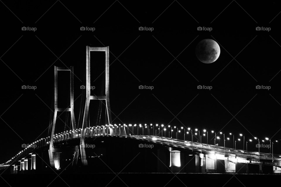 Suramadu bridge and the full moon above it