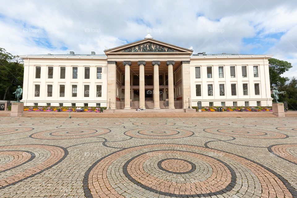 Old building with geometric circle patterns on the ground, architecture in Oslo Norway 