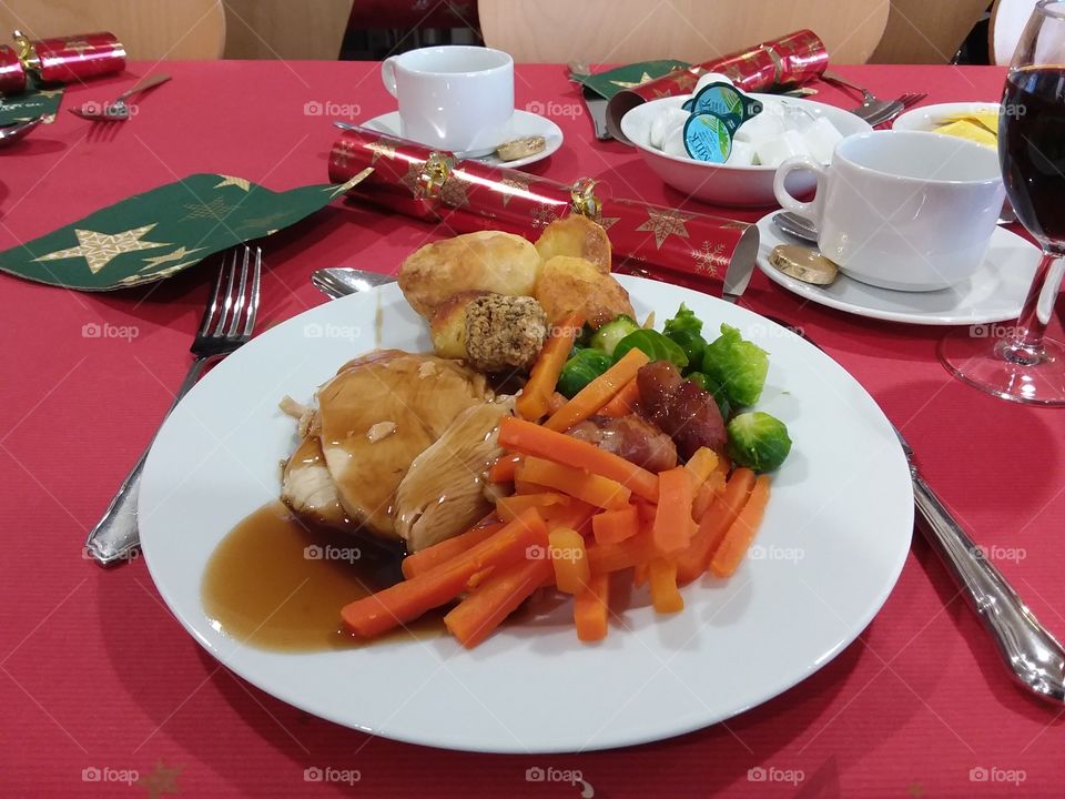 Christmas dinner table display and food meat potato and vegetables