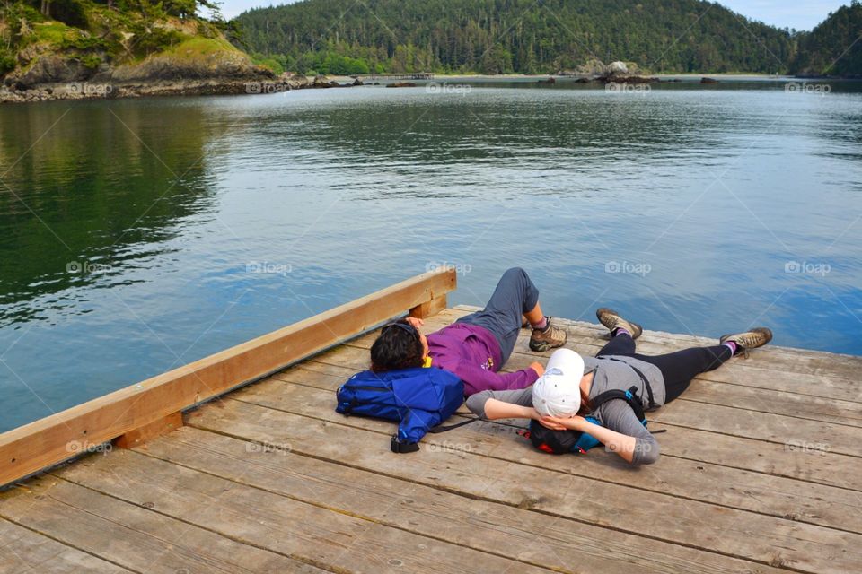 Friends relaxing on the dock