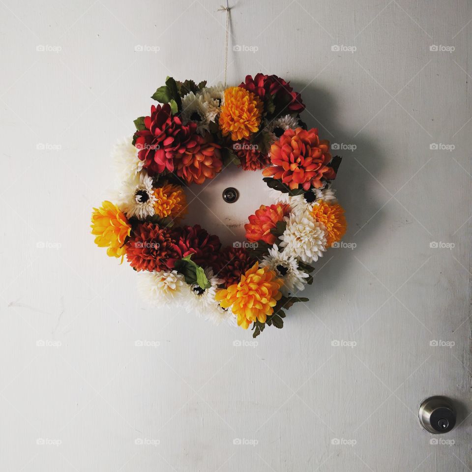 DIY fall wreath, made with fabric flowers so it can be reused in the future.
