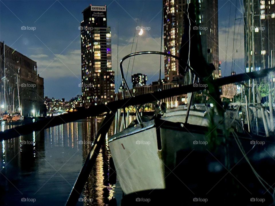 “Newtown Creek” in LIC, Queens is especially charming at night illuminated only by a sichel moon and the electric lights of high rises in LIC and “Greenpoint”, Bklyn as well as their reflections in the water. 2024. Hypnotic Productions