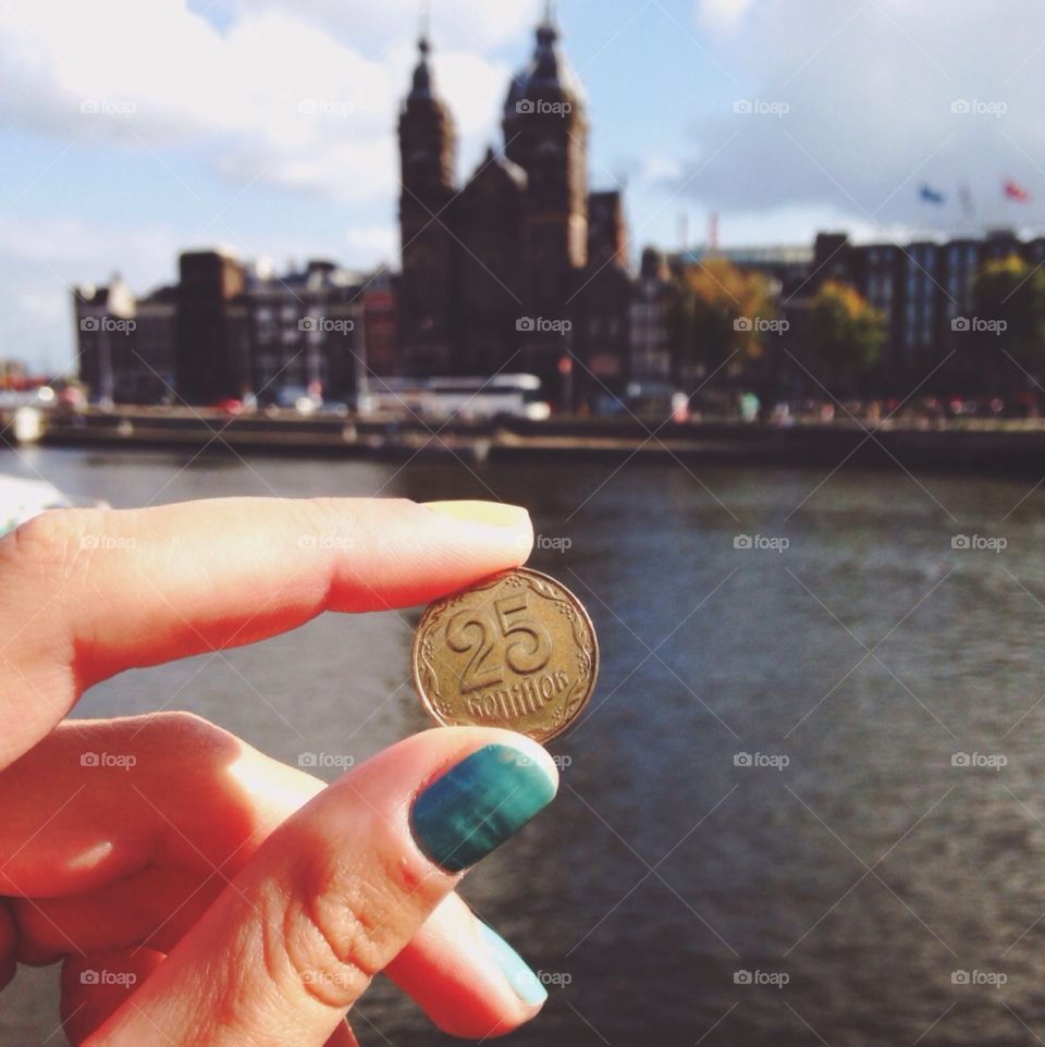 Coin in hand in Amsterdam