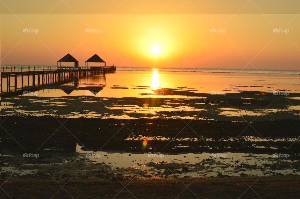 yellow sunset at the jetty in summer