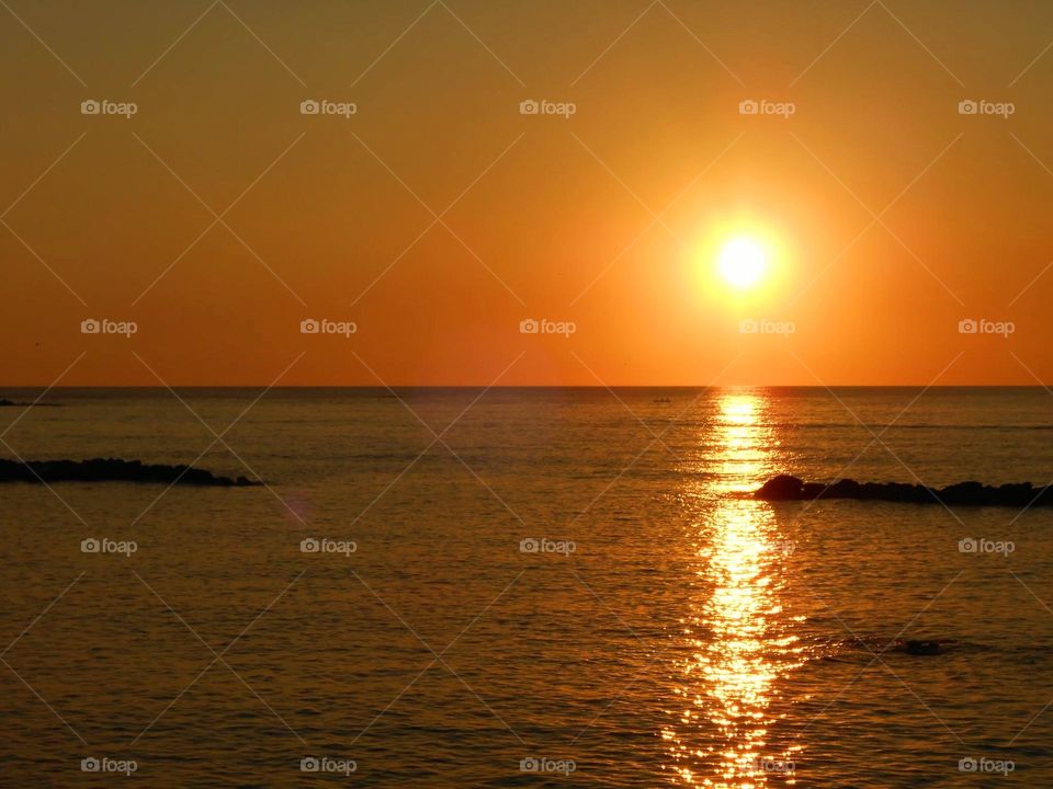 The golden sunset in Fortino Beach in Forio on the Italian island of Ischia
